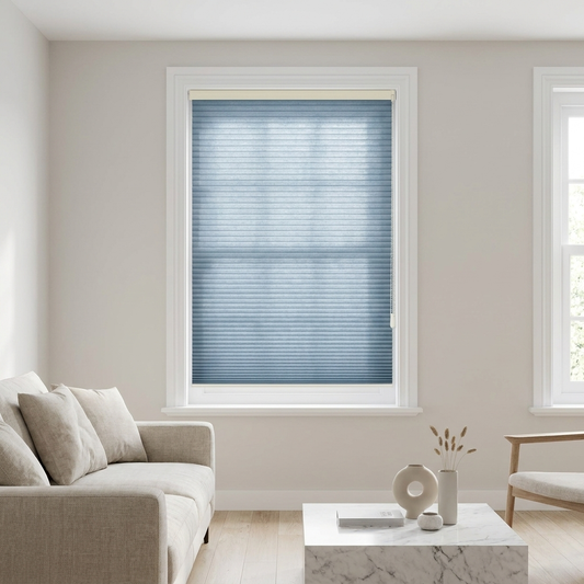 Ready-made honeycomb cellular blind in Dusty Blue on a bright window